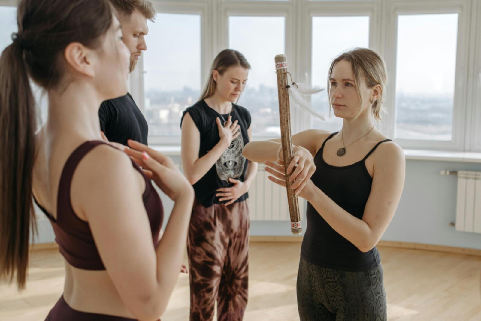 Students practicing yoga in a peaceful studio setting